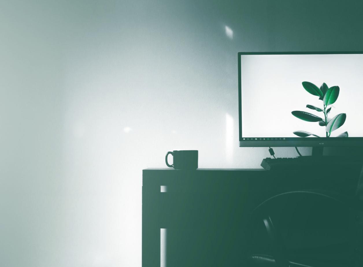 Team collaboration session reviewing security metrics on multiple screens